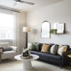 Living room with couch, large window and lamp in the corner at broadstone garden oaks in houston, tx